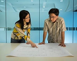 Man and Woman collaborate on technology development
