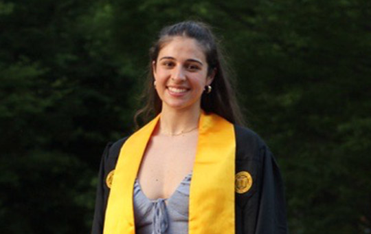 female student wearing academic regalia.